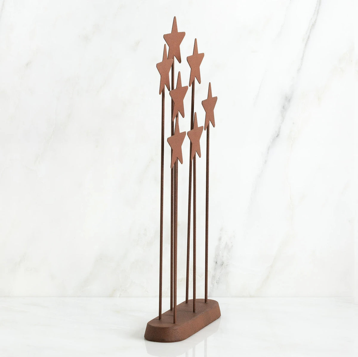 Bronze plaque with star stands on top of it